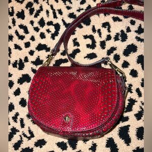 Cherry red embossed Rebecca Minkoff small Astor saddle bag